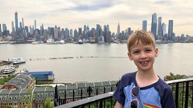 Boy with New York City skyline